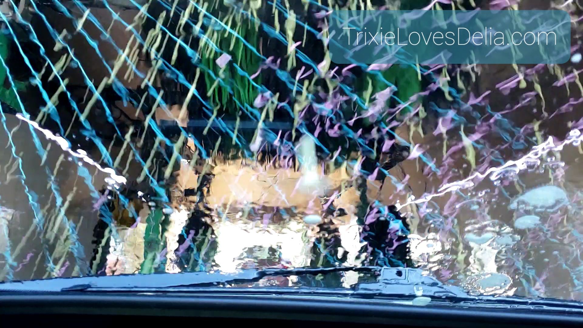 photo taken through windshield in carwash with TrixieLovesDelia.com text overlay